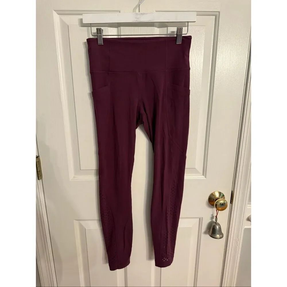 Athleta Plum Laser Cut Salutation Tights Leggings sz S EUC